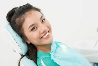 woman laying back in the dental chair at Smiles on Elston in Chicago, IL