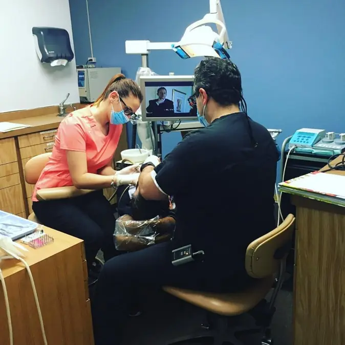 Chicago dentist Dr. Alin Alkass providing dental care for a patient at Smiles on Elston