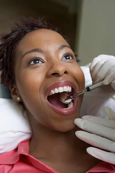 woman getting a dental checkup at Smiles on Elston