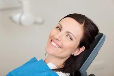 woman smiling during her restorative dentistry appointment at Smiles on Elston