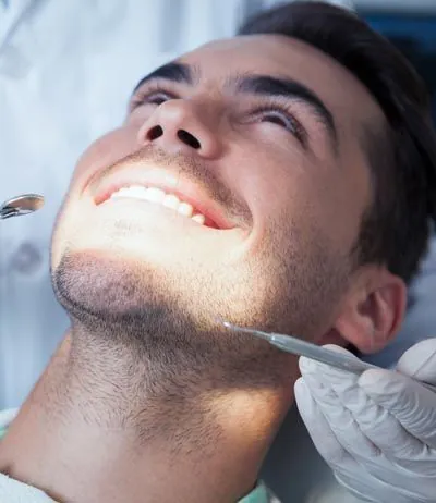 man receiving restorative dental care at Smiles on Elston