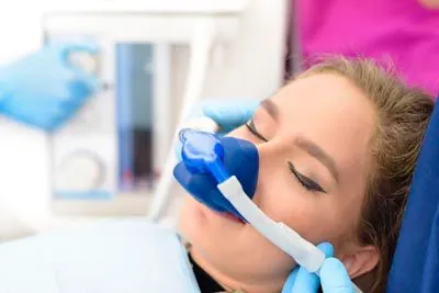 woman sleeping during her dental procedure at Smiles on Elston